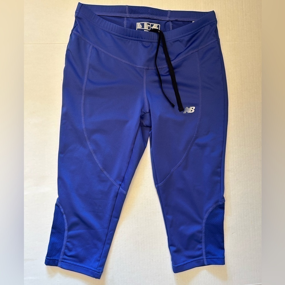 New‎ Balance purple crop leggings with elastic waist & draw string. Sz-M. O10
